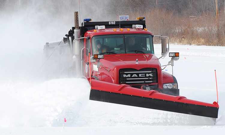 Image of a Carver County snow plow in action