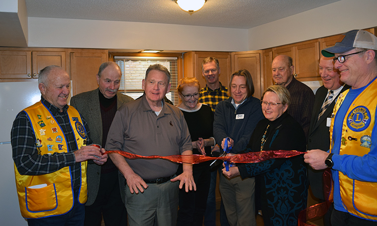 Group photo of ribbon cutting ceremony for veterans housing project